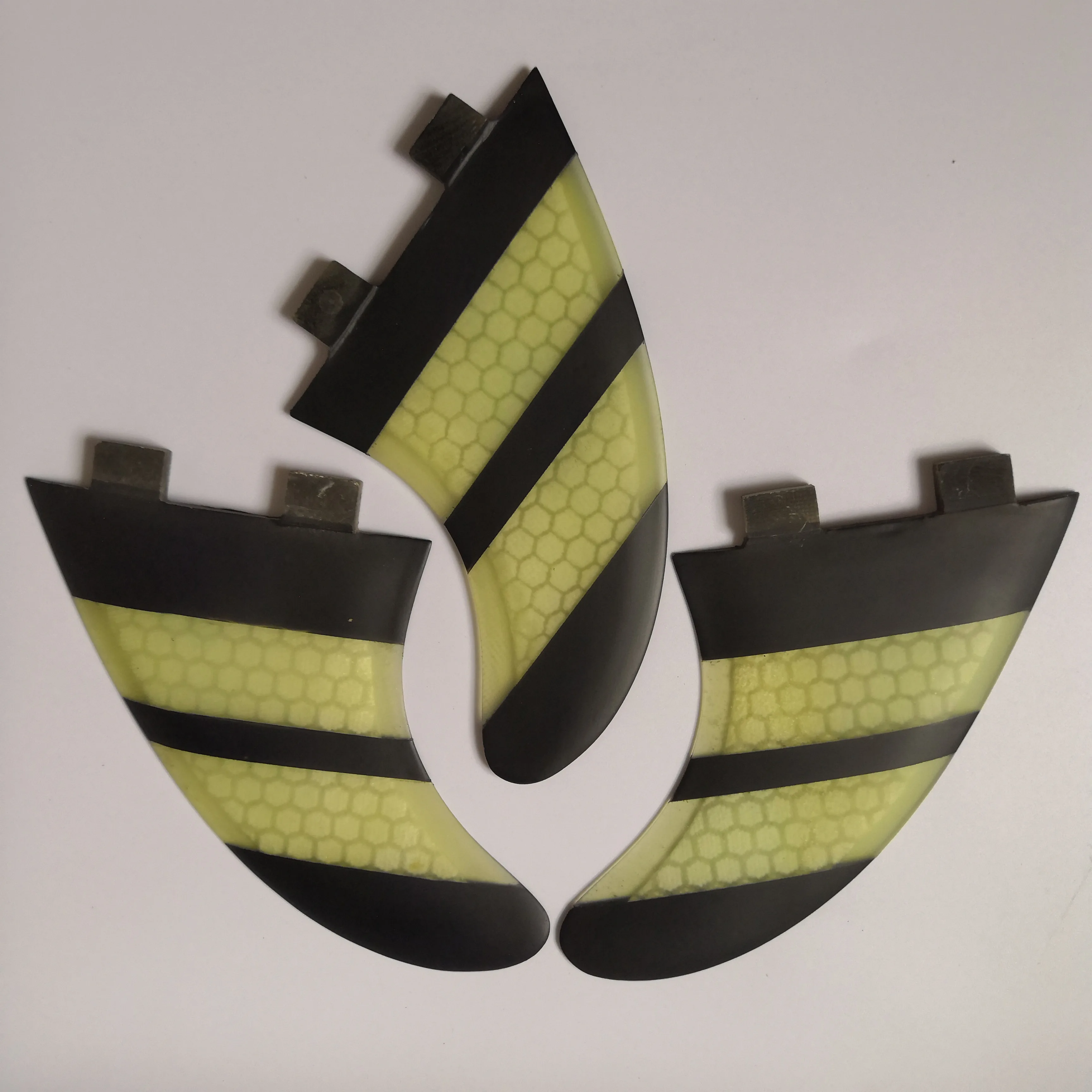 

black and white FCS surfboard fins