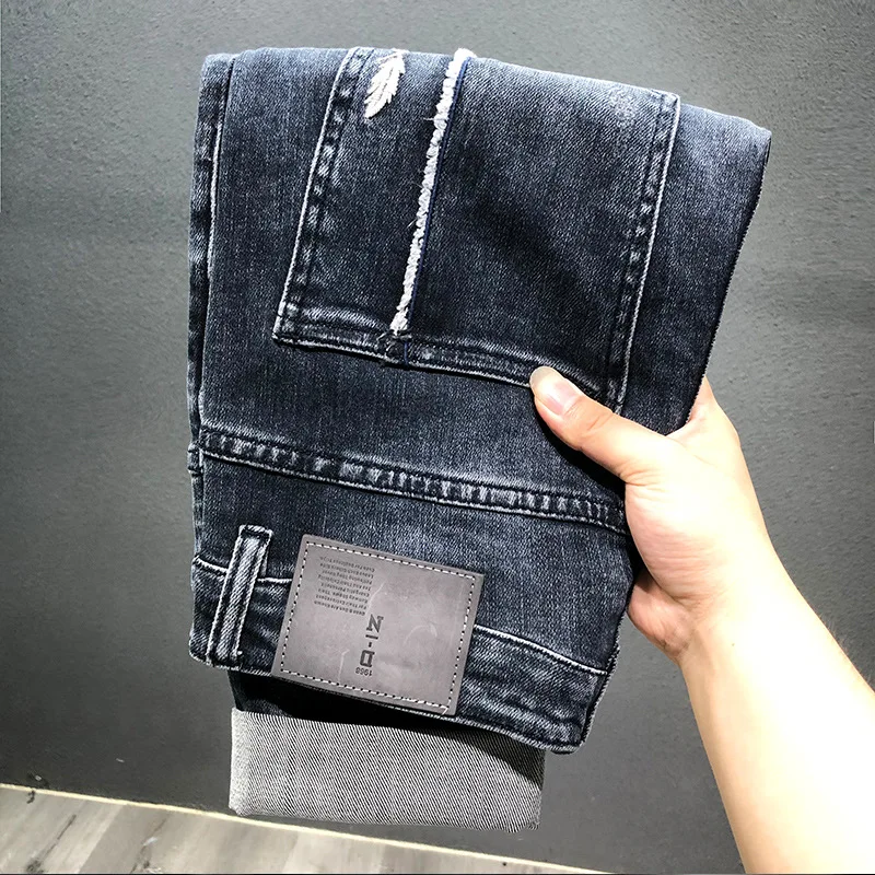 Korean Style Fashion Men Jeans Autumn Newly Designer Elastic Retro Blue Ripped Jeans Men Embroidery Designer Denim Harem Pants