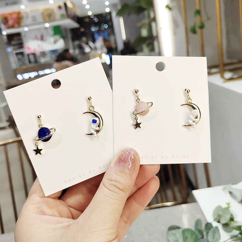 

2021 cute and playful earrings astronaut hug the moon cartoon earrings asymmetric planet star earrings February 14 gift