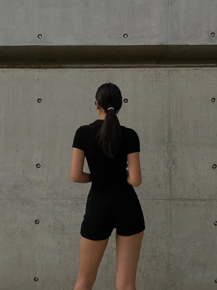 

European and American black V-neck temperament one-piece shorts women's summer waist waist slimming single-breasted jumpsuit