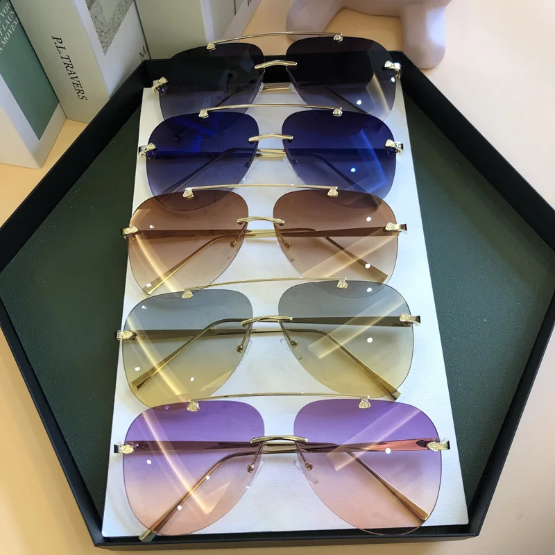

2021 Luxury Designer Fashion Oval Rimless Sunglasses Summer Glasses Fashion Sun glasses For Men Women UV400 gafas de sol para