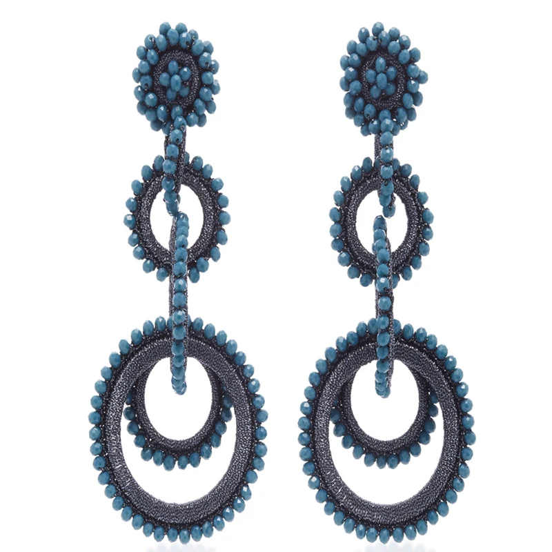 Большие серьги-подвески с перекрывающимися кольцами и кристаллами массивные