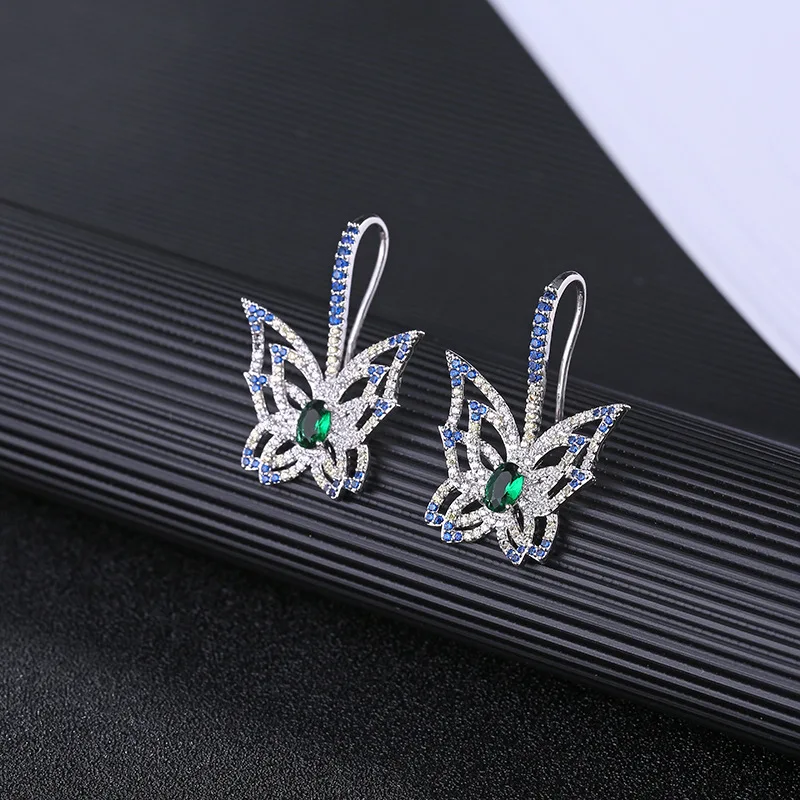 

Copper micro-inlaid zircon earrings color hollow exaggerated butterfly women's short earrings women's earrings factory direct sa
