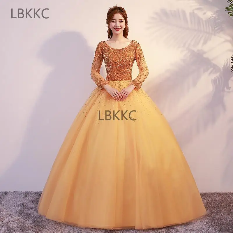 

Gold Quincenera Dress Tulle Long Sleeves Ball Gown Quinceanera Dresses Beading Crystal Puffy Plus Size Dress For Sweet 16