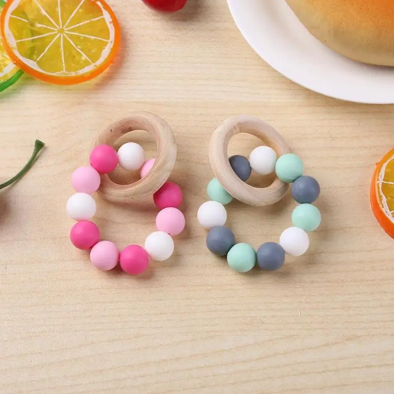 

Infant Silicone Chew Nursing Bracelet for Baby Wooden Teethers Baby Rattle Stroller Accessories Toys