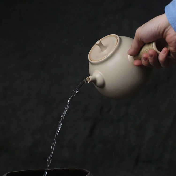 

white clay pottery side the boiling kettle electric TaoLu flame charcoal stove alcohol lamp tea tea warm boiled water