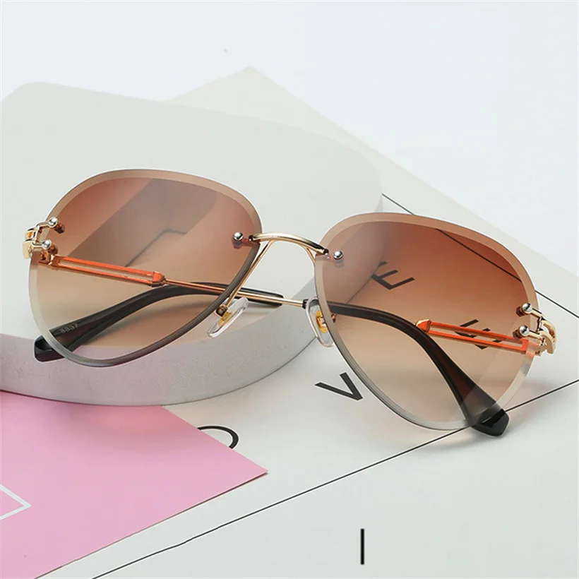 

Rimless Sunglasses Women Fashion Designer Sun Glasses Metal Farme Gradient Shades Cutting Lens Famale Goggles UV400