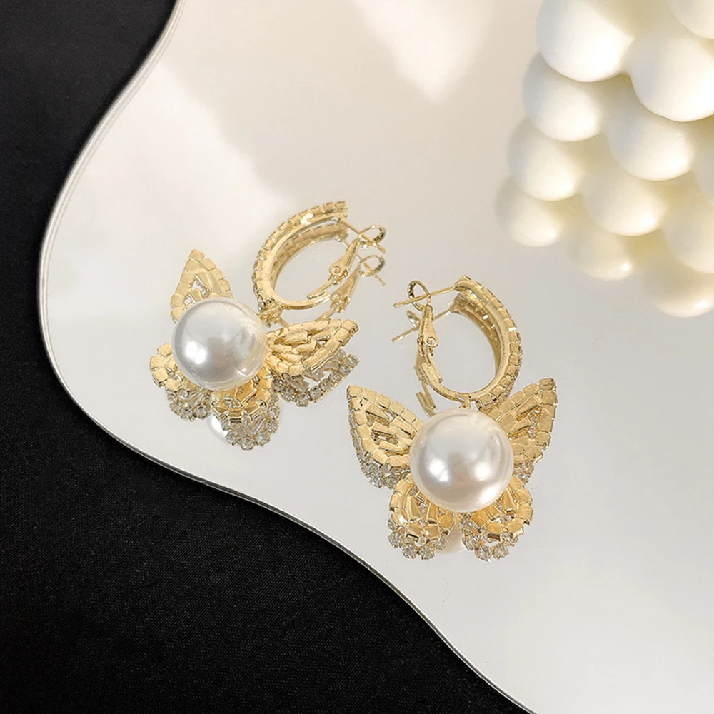 

S925 silver needle super flash butterfly earrings luxury dazzling butterfly pearl ear hook female niche earrings earrings