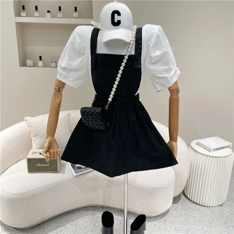 

Niche Design New Women's Clothing Summer 2021 Fashion Drawstring Strap Sling Skirt + Loose Puff Sleeve T-shirt Two Piece Set