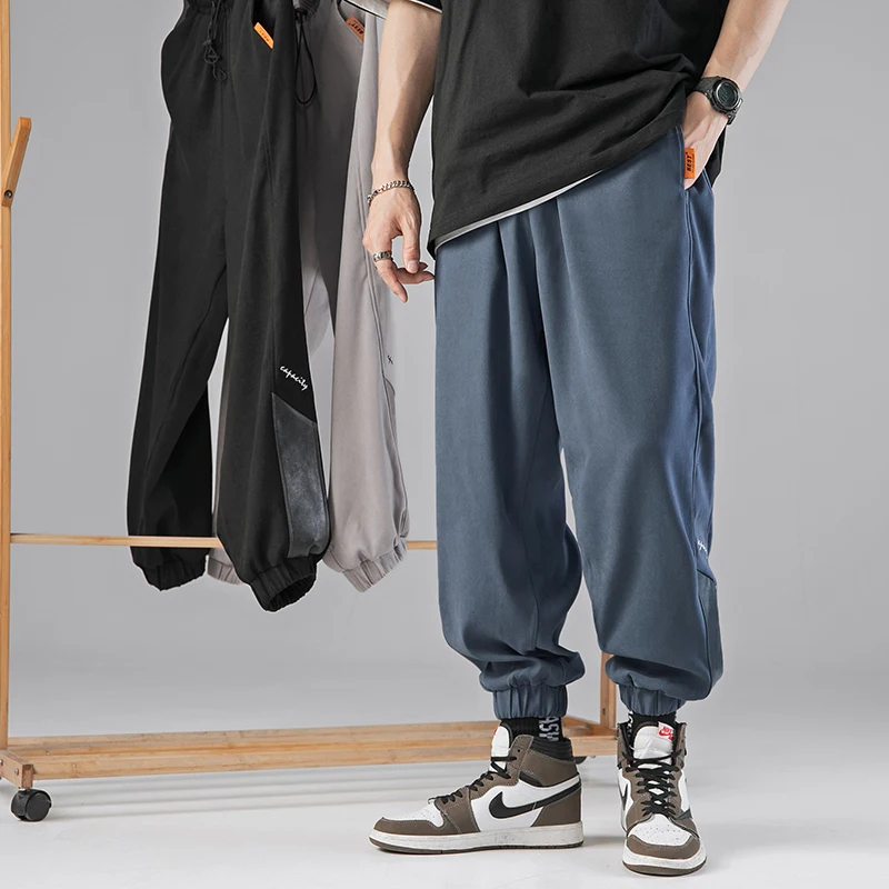 

HanLuThe Main Push 2021 Spring And Summer Long Sports Pants New Splicing Loose Casual Pants Harajuku Men's Sports Sanding Pants