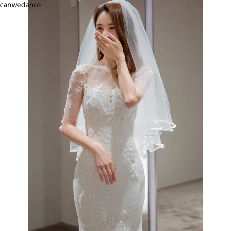 

2020 O-Neck Lace Appliques Sweep Train Mermaid Wedding Dresses Short Sleeve Illusion Buttons Backless Bridal Gowns