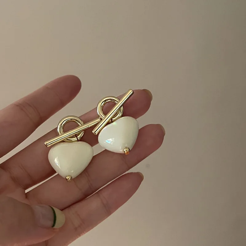 

Minar Lovely White Enamel Love Heart Pendant Earrings for Women Girls Gold Color OT Clasp Metallic Dangle Earrings Accessories