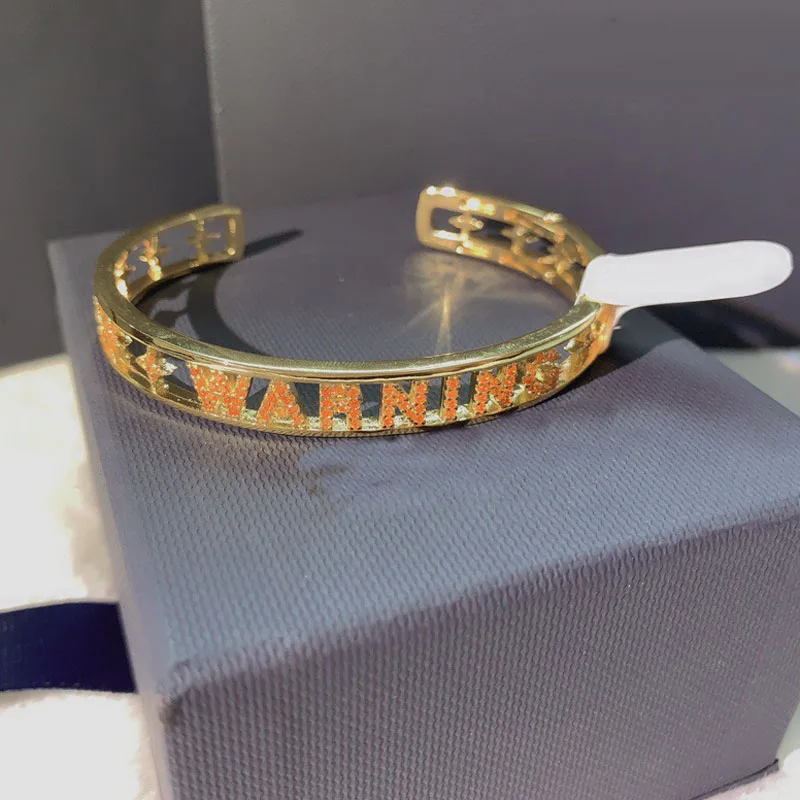 

UMGODLY Copper Bangle High Quality Yellow Gold Color Orange Letters Warning Open Cuff Pave Zirconia CZ Bracelet Women Jewelry