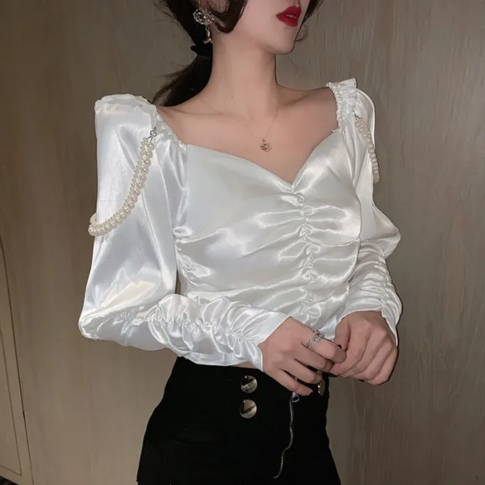 

Design feeling sexy small brim joker v-neck shirt pearl 2020 new female long-sleeved jacket fold cultivate morality