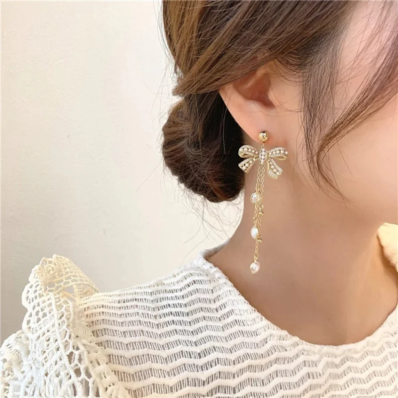 

South Korean Fashion Pearl Tassel Earrings S925 Silver Needle High-end Elegant and Thin Bow Earrings Female Trend Jewelry