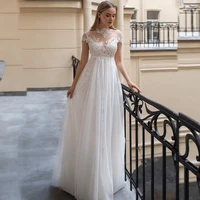 high neck tulle wedding dresses 2021 lace appliques short sleeves illusion pearls floor length bridal gowns robe de mariage