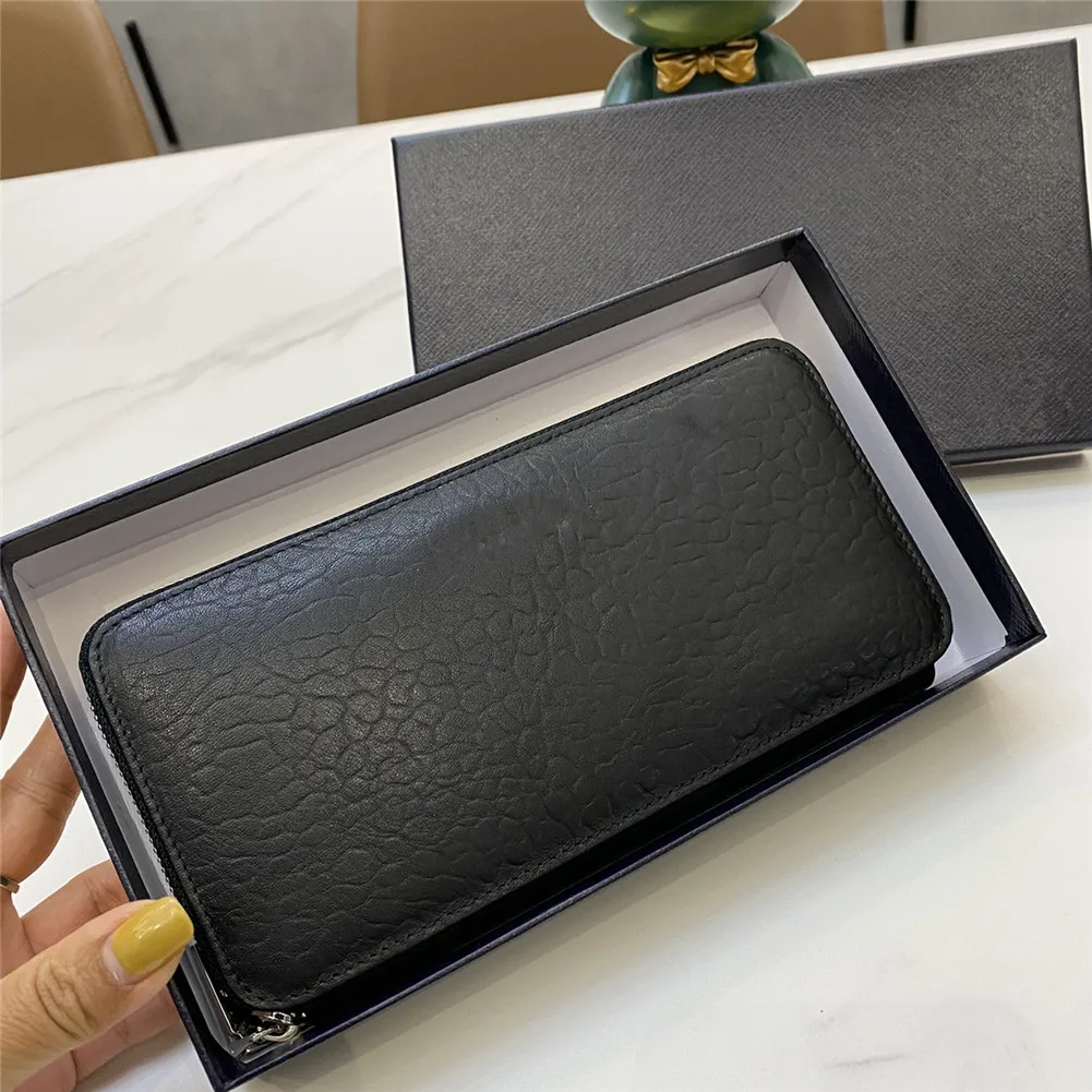 

New leather men and women large-capacity fashion handbag messenger bag clutch