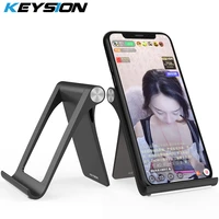 KEYSION Live Phone Holder Stand for iPhone Pro Foldable Mobile Phone Stand for Samsung S21 Desk Tablet Stand for Xiaomi