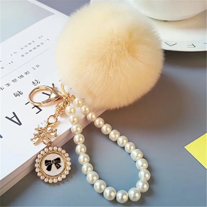 2022 Fashion Pearl Chain Crystal Bottle Bow Pompom Keychain Car Women handBag Key Chain Ring Fluffy Puff Ball Keychains Jewelry