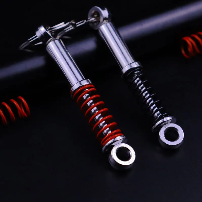 

New Fashion Car Shock Absorber Keychain for Car Lovers Creative Unisex Car Bag Metal Spring Keyrings Pendant Gifts