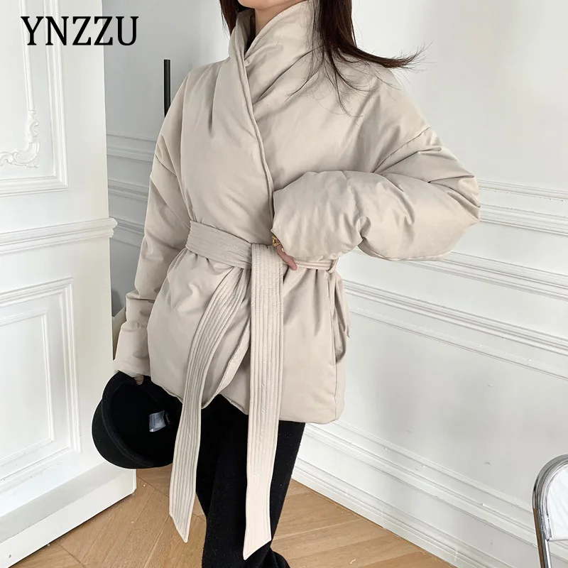 

2021 Winter women sashes down jacket High quality Solid Long sleeve Female Outwear Crossover design short coat Oversized 1O241