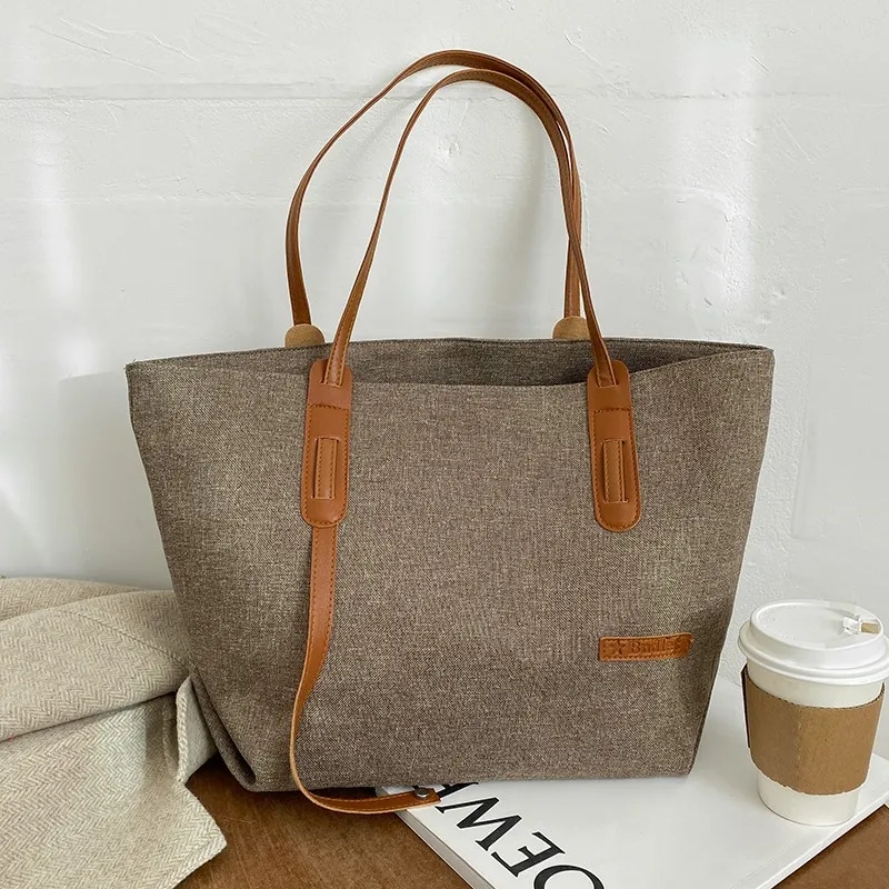 2021 Women's Autumn Winter New Solid Color Commuter Bag Large Capacity Fashion Simple Horse Pendant Shoulder Bag Female Brand