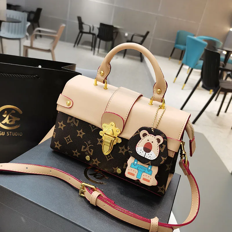 

Presbyopia Printed Metal Lock Clamshell Handbags 2021 New Commuter Fashion European and American Shoulder Bag Messenger Bag Gg