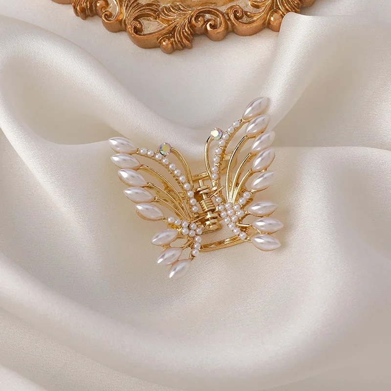 

Origin Summer Korean Rhinestone Butterfly Imitation Pearl Hair Claw Shark Hair Clamps for Women Delicate Gold Hollow Hairwear