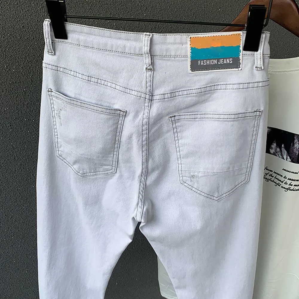 Модные белые рваные джинсы Мужские обтягивающие джинсовые штаны облегающие