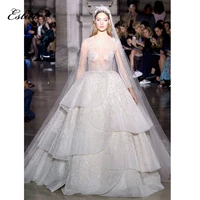 stunning wedding dress ball gown heavy beaded lace luxurious bridal gown long sleeves sheer bodice sexy design wedding gown