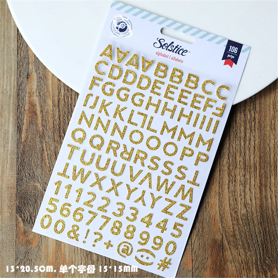 Набор золотистых и серебристых бумажных наклеек в виде порошка высечка для