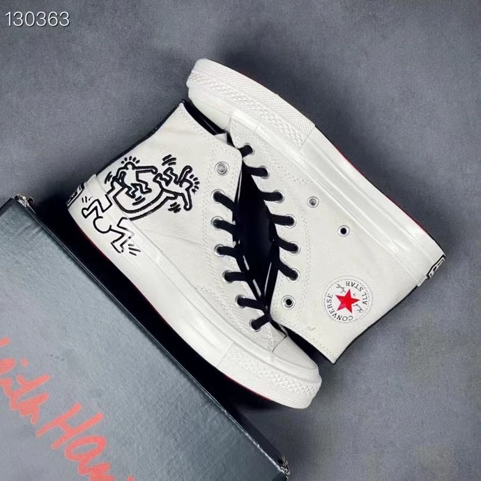 

Converse Keith Harding Artist Collaboration Collection has an artist's embroidered red heart logo on the tongue and inside