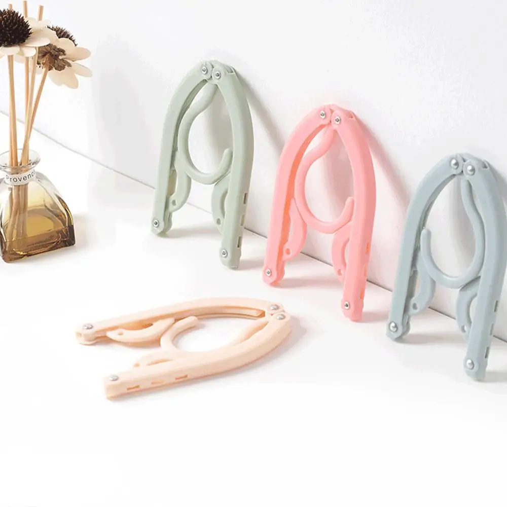 Travel clothes hanger Portable Folding Clothes Hanger Multifunction Magic Stretch Drying Rack Home Wardrobe Storage | Дом и сад