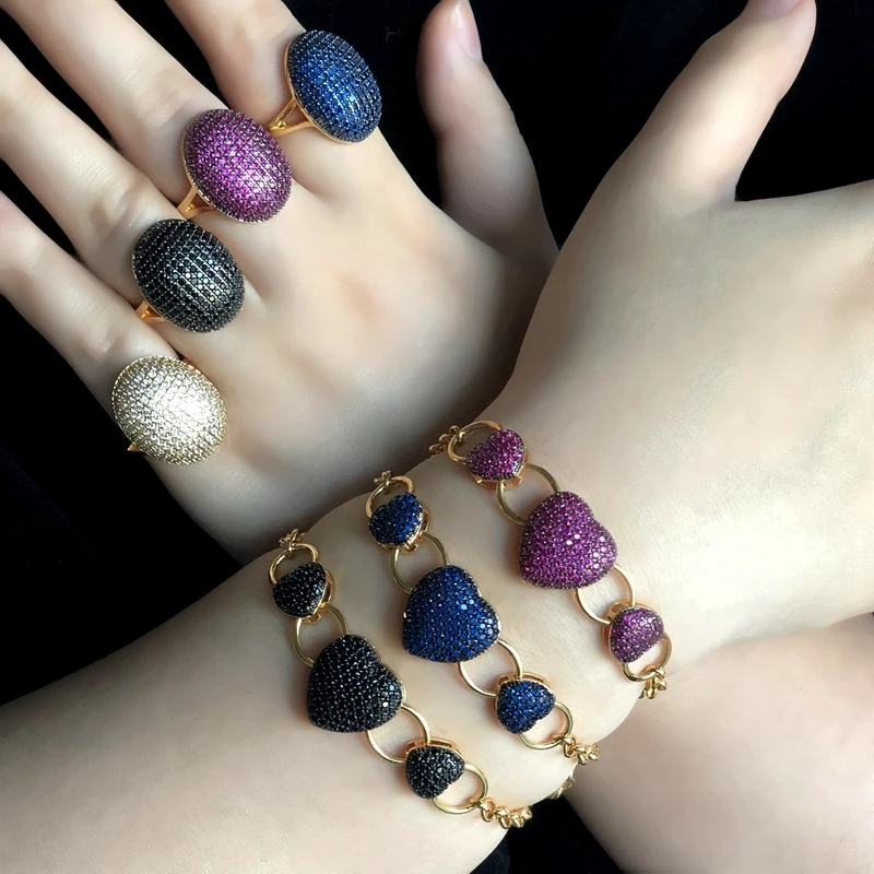 Женское кольцо с овальной геометрией массивное микро закрепкой цветной