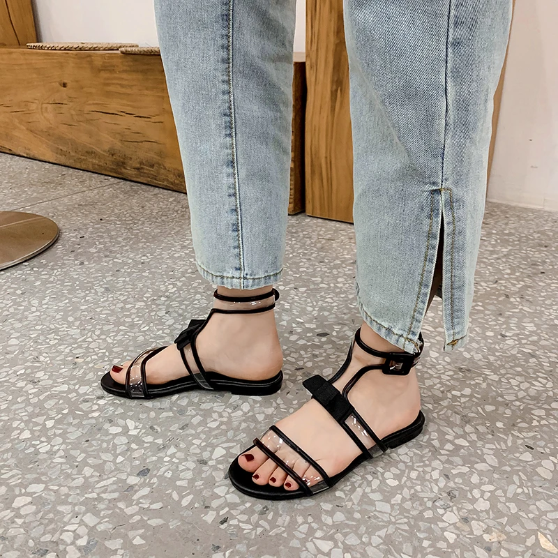 

NIUFUNI 2021 Flat Bow Snake Skin Roman Women's Sandals With Buckle Transparent PVC Round Toes Women's Shoes Casual Sexy Sandals