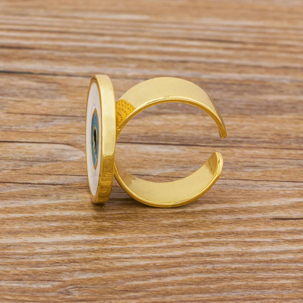 Кольца женские медные золотистые регулируемые с большим синим и белым глазом |