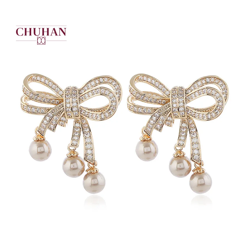 Женские серьги-гвоздики в виде банта золотого и серебряного цвета | Украшения