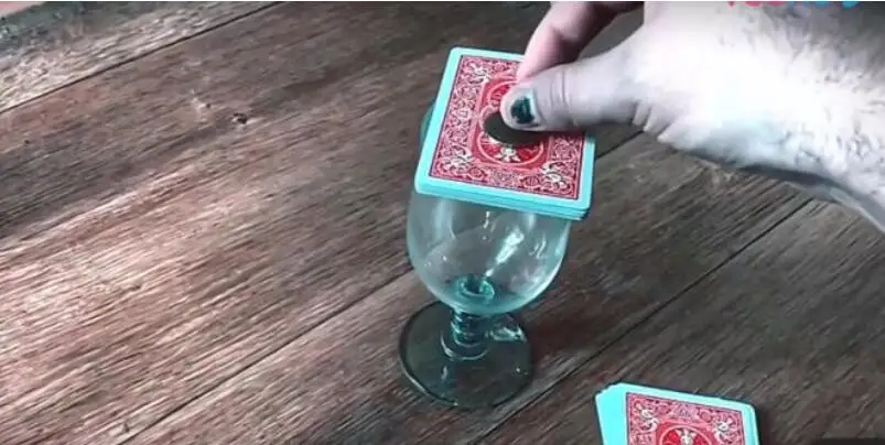 

Coin Thru Deck - Magic Instructions Magic trick