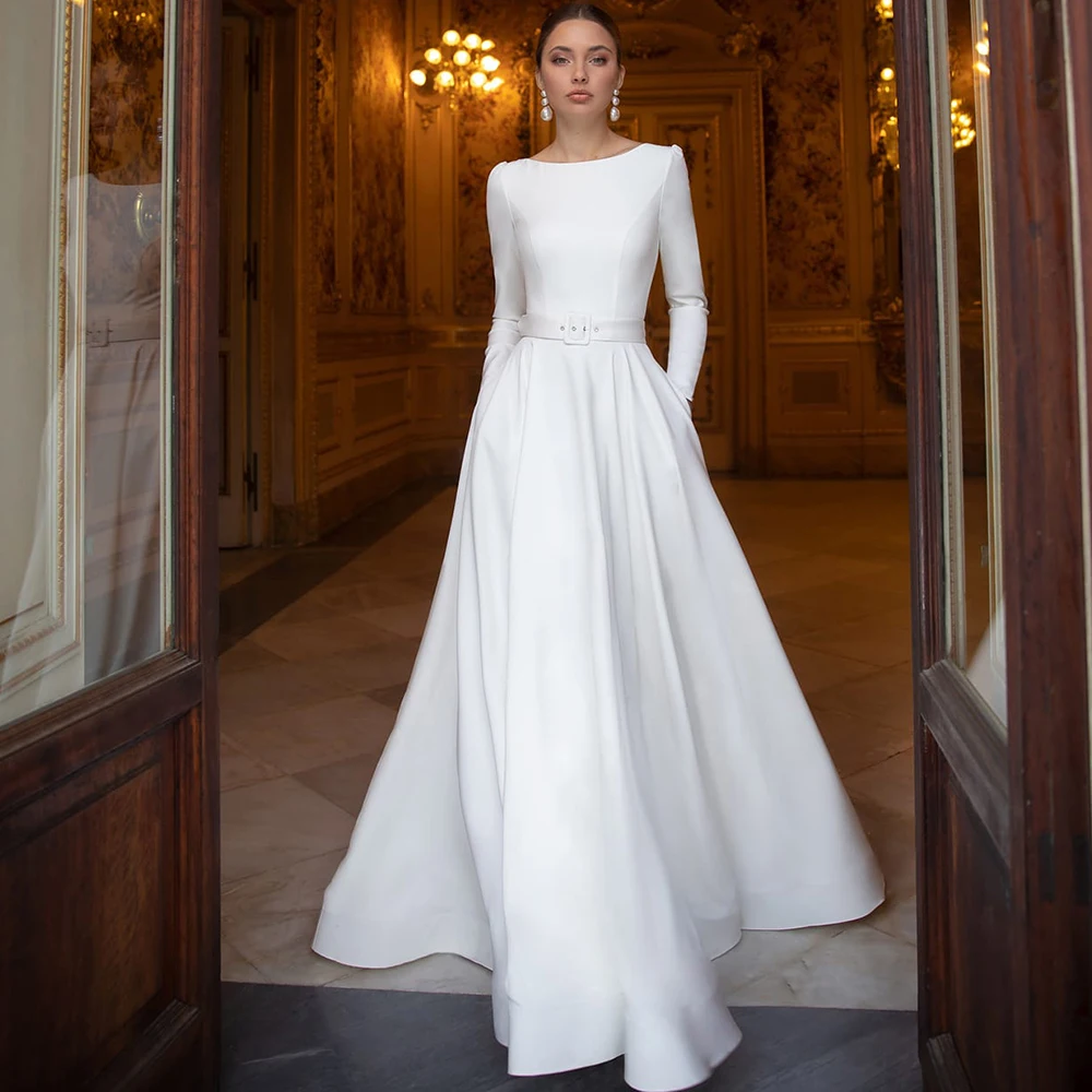 

Женское платье с круглым вырезом, длинным рукавом и карманами