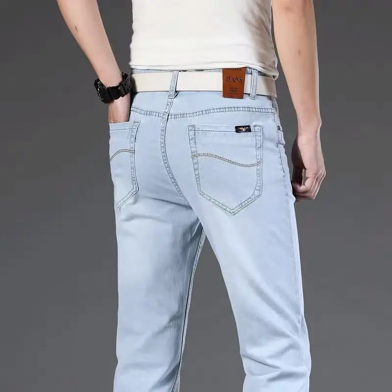 2021light jeans men's plus size straight loose elastic high-end tide brand light blue and white casual trousers bleached jeans