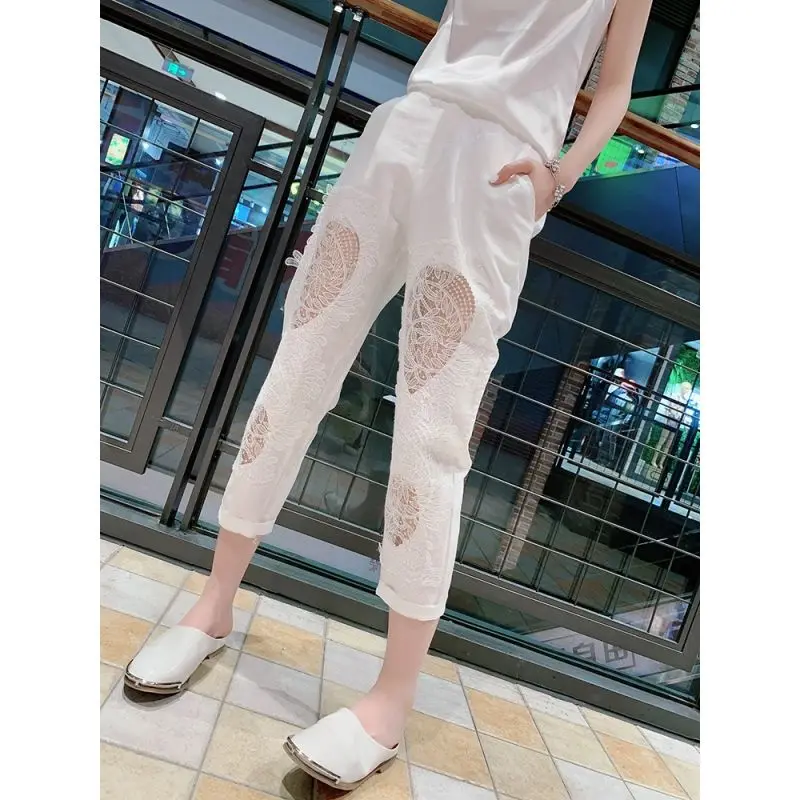 

2021 summer new hemp pants slim nine lace stitching holes hollow casual pants women's pants