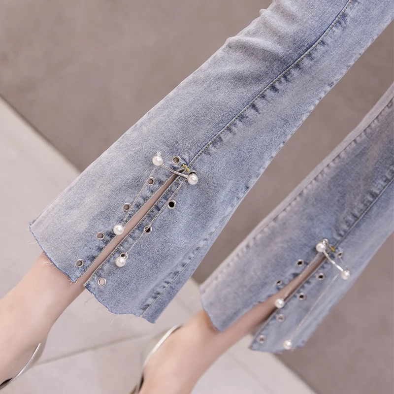 

New open fork micro horn pants are thin high waist elastic pearl straight tube tight light nine point jeans for women