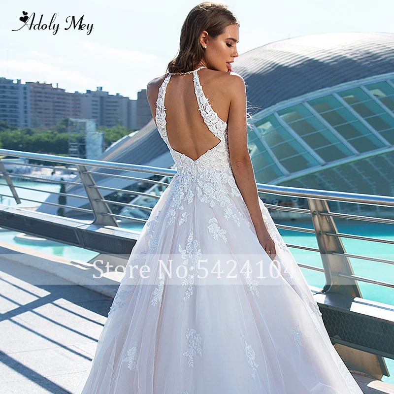 Романтичное свадебное платье-трапеция с лямкой на шее и открытой спиной от Adoly Mey