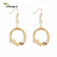 hongye hot selling fashion simple retro pearl drop earrings for women party around handmade round metal beads brincos jewelry