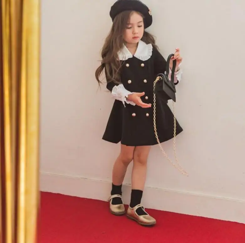 Черно-белое платье в стиле пэчворк 2019 г. Осенне-зимние двубортные платья с