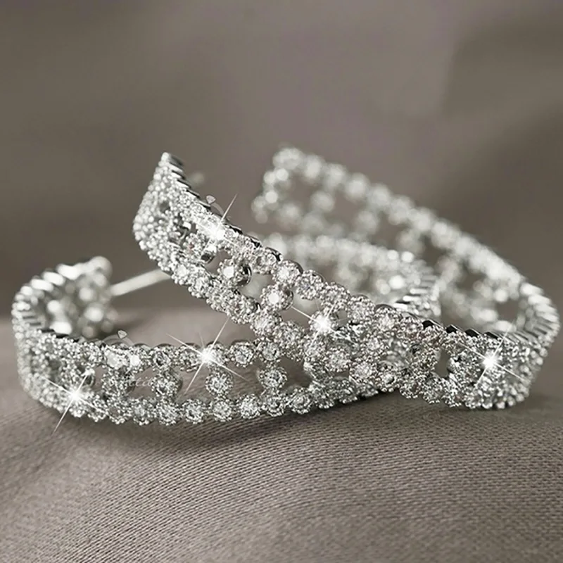 

Dainty Female White Zircon Stone Earrings Dainty Silver Color Wedding Earrings Charm Hollow Round Small Stud Earrings For Women