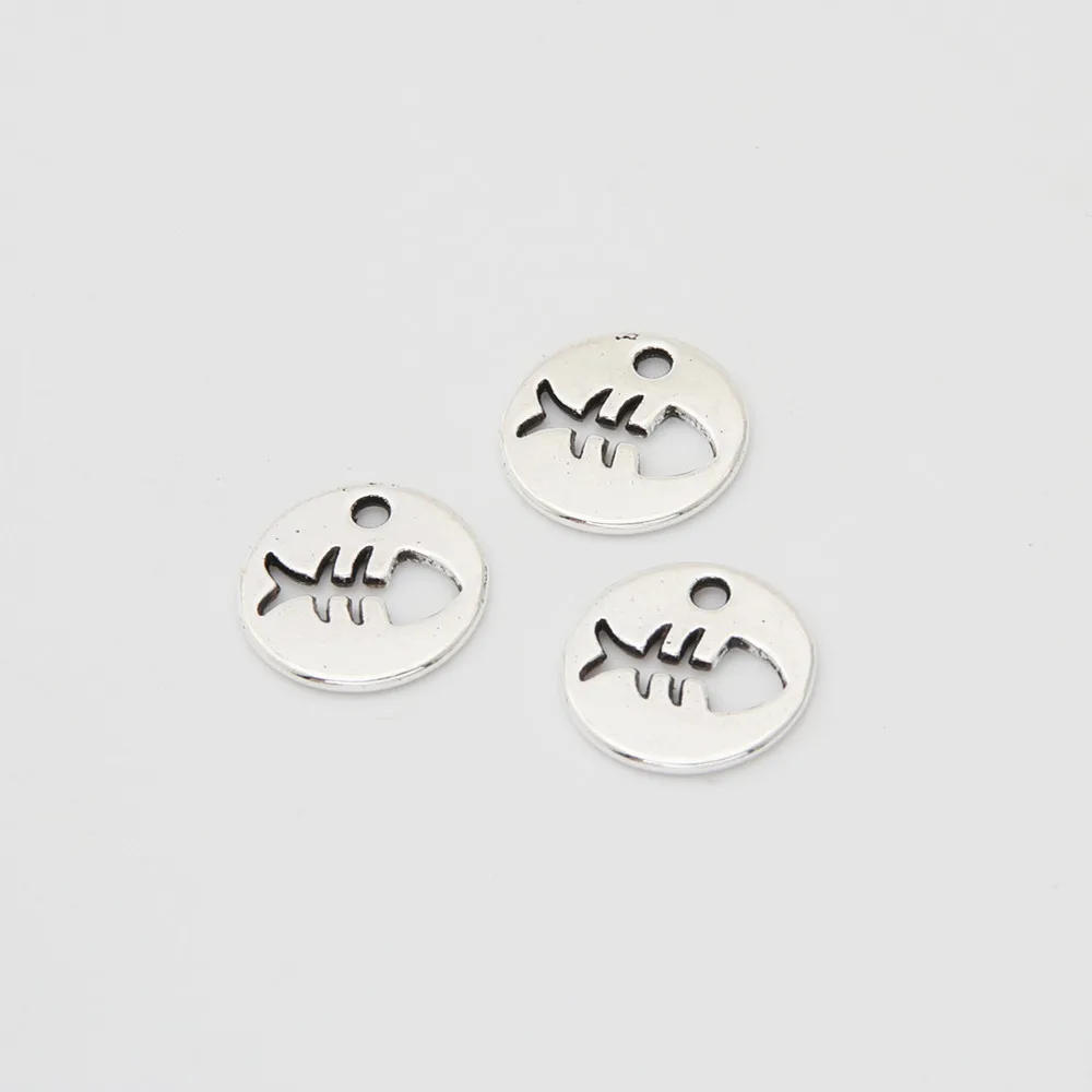 Подвески в виде рыбок круглые серебристые 50 шт. A3387 |