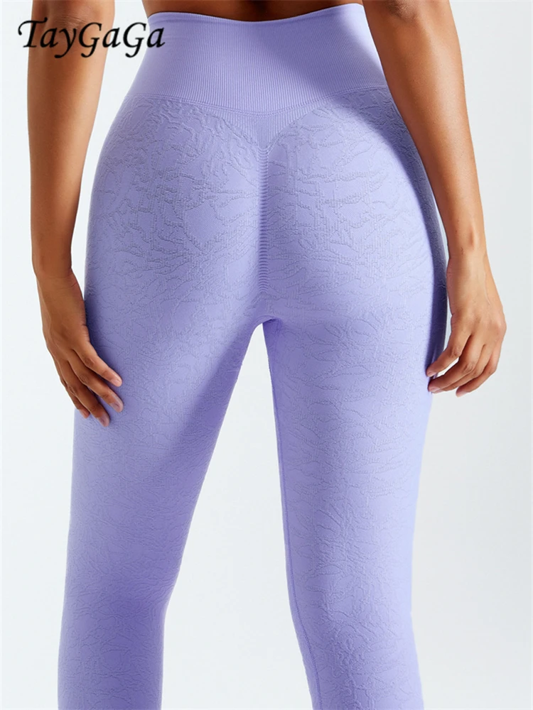 Taygaga Womens Leggings Peach Hip Seamless Quick Dry Threaded Solid Color Leggings High Waist Sports Fitness Hip Lift Yoga Pants