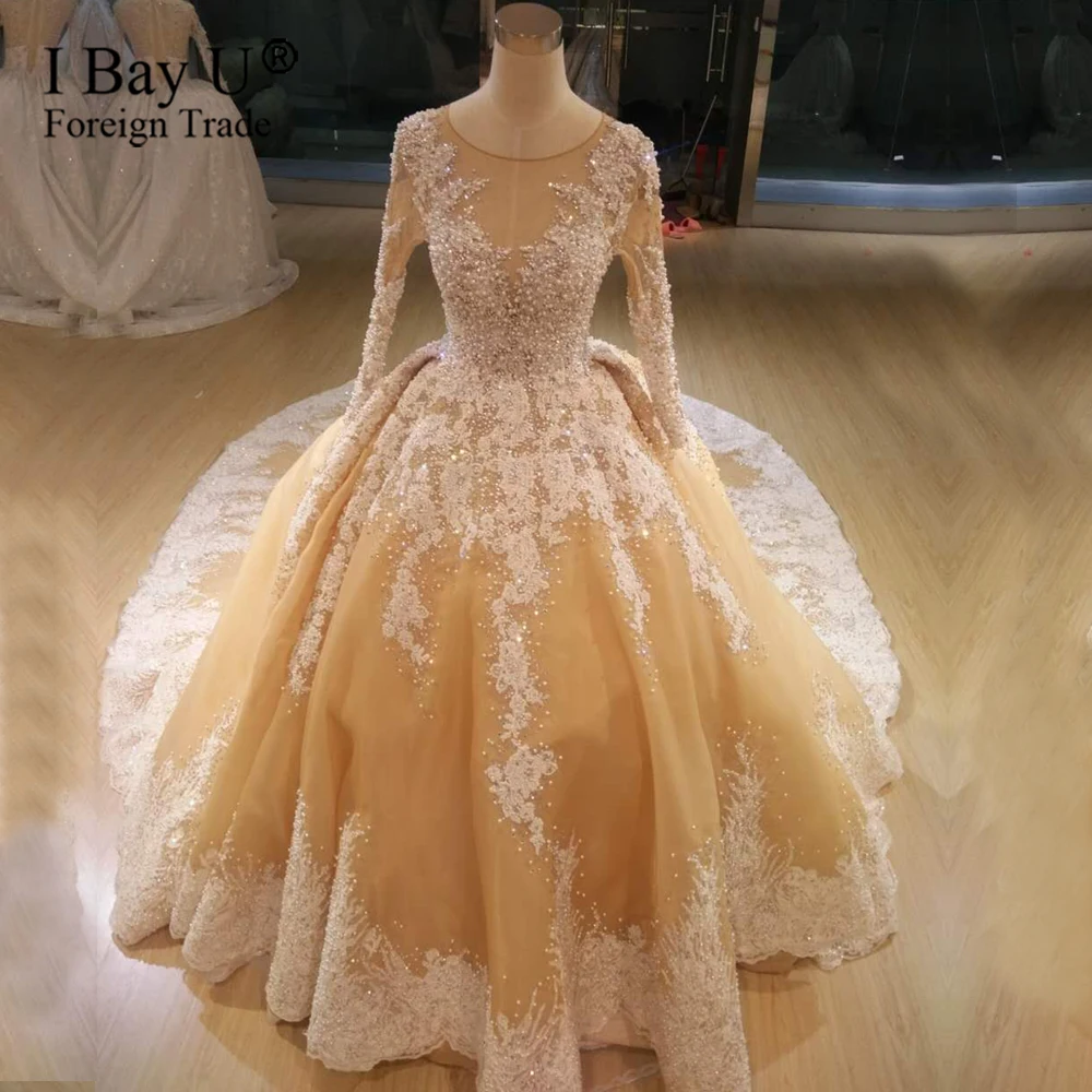 Роскошные свадебные платья с длинным рукавом украшенные камнями 2020