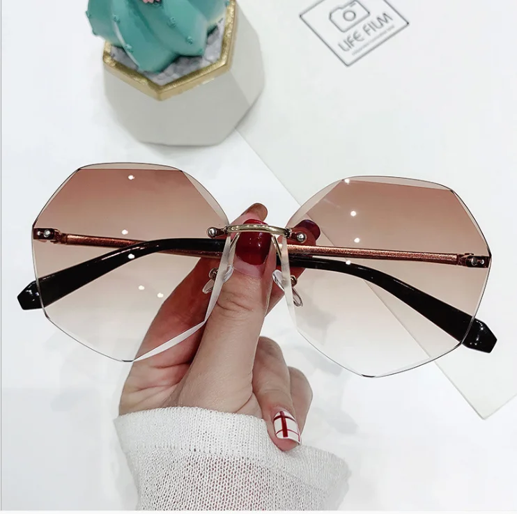 

2021 new metal frameless Sunglasses European and American fashion glasses trimming Sunglasses polygonal women's Sunglasses
